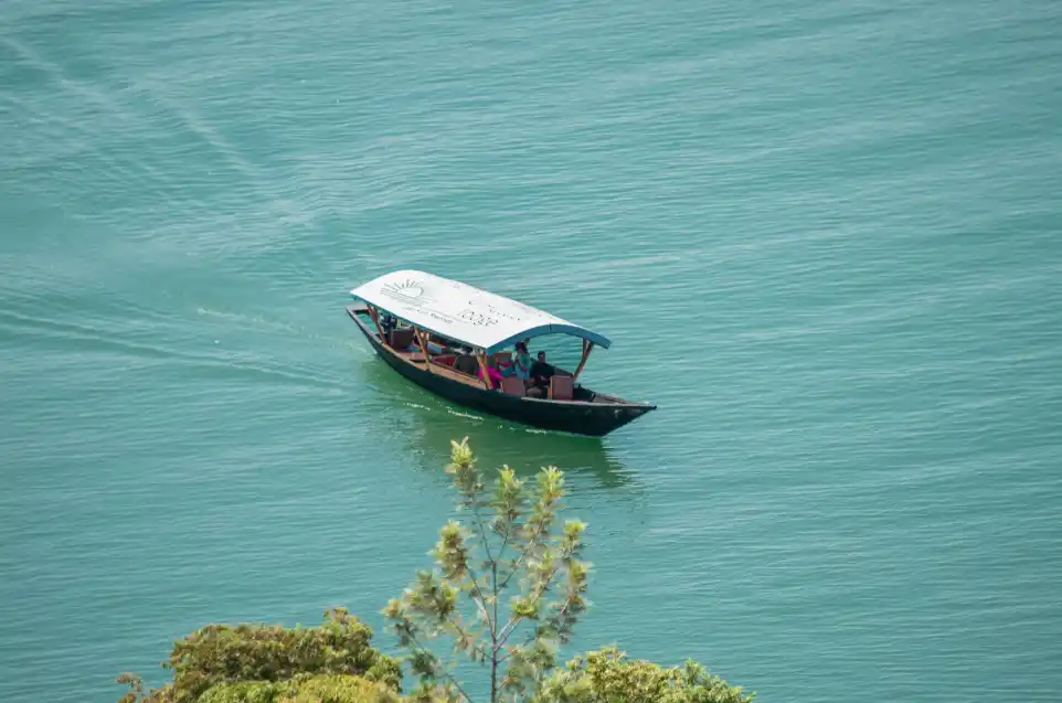 Umutuzo lodge boat with guests enjoying lake tour