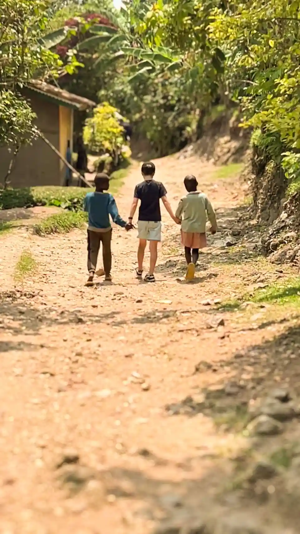 Kids walking around an island in Lake Kivu