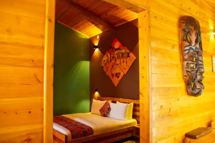 Private eco lodge bedroom overlooking Lake Kivu
