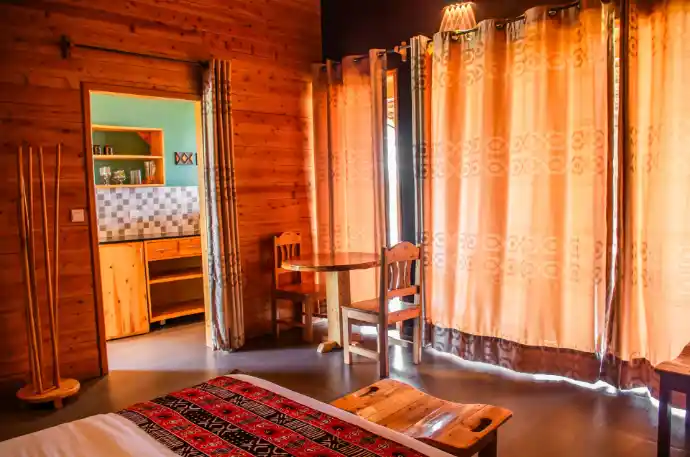 Private eco lodge bedroom overlooking Lake Kivu