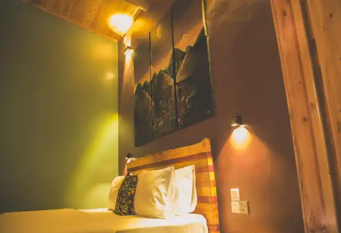 Private eco lodge bedroom overlooking Lake Kivu