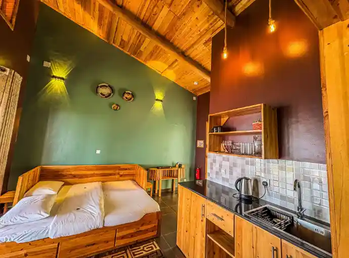 Private eco lodge bedroom overlooking Lake Kivu
