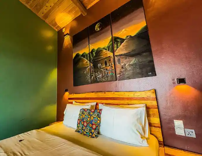 Private eco lodge bedroom overlooking Lake Kivu